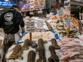 Worker with fish and shellfish at Pike Place Public Market, Seat