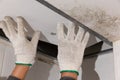 Worker fix leaking pipe in ceiling ,close-up of a stain on the ceiling Royalty Free Stock Photo