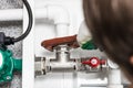 Worker fixing heating system, close up photo Royalty Free Stock Photo