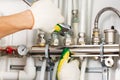 Worker fixing heating system Royalty Free Stock Photo