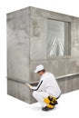 Worker fixing a lath on a corner