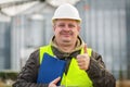 Worker with folder near the factory Royalty Free Stock Photo