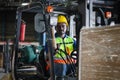 Worker on forklift, Manual workers working in warehouse, Worker driver at warehouse forklift loader works Royalty Free Stock Photo