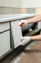 Worker forms the sidebar bath. Royalty Free Stock Photo