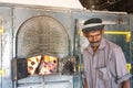 Worker in front of open steam boiler in the Blue Field Tea Factory