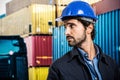Worker in front of a stack of containers Royalty Free Stock Photo