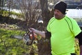 Worker in the garden with a chainsaw.