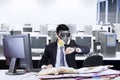Worker with gas mask in office Royalty Free Stock Photo