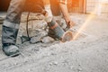 A worker with an angle grinder cuts the concrete pavement of the road, and sparks fly. Royalty Free Stock Photo