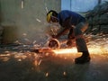 Worker grinder machine cutting steel at a factory sep20 Friday 9:25 am Rich terre port Louis Mauritius