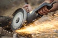 Worker grinding cutting metal sheet Royalty Free Stock Photo