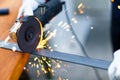 Worker grinding a metal plate Royalty Free Stock Photo