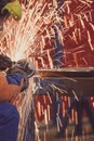Worker grinding a metal plate Royalty Free Stock Photo