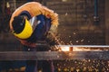 Worker grinding a metal plate Royalty Free Stock Photo