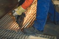 Worker grinding a metal plate Royalty Free Stock Photo
