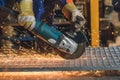 Worker grinding a metal plate Royalty Free Stock Photo