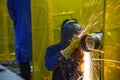 The worker grinding the steel pipe after welding Royalty Free Stock Photo