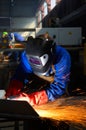 Worker grinding/welding