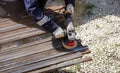 A worker grinds a rusty metal pipe Royalty Free Stock Photo