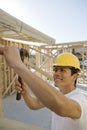 Worker Hammering At Construction Site Royalty Free Stock Photo