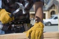 Worker Hammering Nail At Site