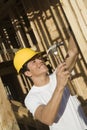 Worker Hammering Nail On Wooden Wall Royalty Free Stock Photo