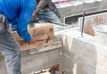 Worker hammering nails on wooden formwork for concrete beam Royalty Free Stock Photo