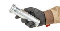 Worker hand in black protective glove and brown uniform with small old aluminum flashlight isolated on white background Royalty Free Stock Photo