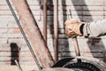 Worker hand pulling the lever of a pile driver