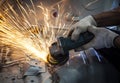 worker hand working by industry tool cutting steel with split fire use for industrial manufacturing theme