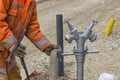 Worker hands connects supply hose