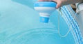 Worker hands disinfection and chlorination of water in the pool. Purification from pollution pool chloral dispenser