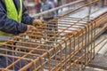 Worker hands fixing steel reinforcement bars Royalty Free Stock Photo