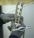 Worker hands holding clamps for cables of an air conditioner