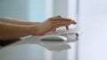 Worker hands holding mouse using wireless device at bright home office closeup. Royalty Free Stock Photo