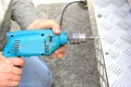 Worker using electric drill Royalty Free Stock Photo