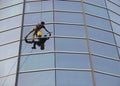 Worker cleaning windows.