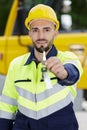 worker with hardhat on showing key Royalty Free Stock Photo