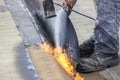 Worker heating and melting bitumen felt 3 Royalty Free Stock Photo