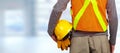 Worker with helmet in orange security vest. Royalty Free Stock Photo