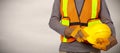 Worker with helmet in orange security vest. Royalty Free Stock Photo