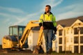 Worker in helmet on site construction. Man excavator bulldozer worker. Construction driver worker with excavator on the