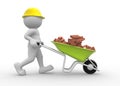 Worker with helmet and wheelbarrow