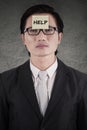 Worker with a help text on forehead Royalty Free Stock Photo