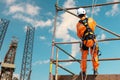 Worker on high on scaffolding