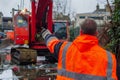 worker with a highvis jacket signaling crane mishap