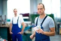 Worker with his wages Royalty Free Stock Photo