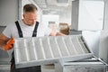 Worker holding air filter for installing in the office ventilation system. Purity of the air concept. Royalty Free Stock Photo