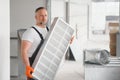 Worker holding air filter for installing in the office ventilation system. Purity of the air concept. Royalty Free Stock Photo