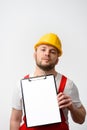 Worker holding blank clipboard on white background Royalty Free Stock Photo